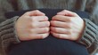 © Slowlifetrader - A close-up of hands tightly hugging a black pillow, symbolizing embracing mistakes and learning from failure. Acceptance of failure.