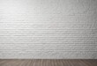 © denny - Empty room interior featuring a clean white painted brick wall and a dark wooden floor, perfect as a background or for product display