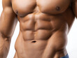 © Phatharapol - Close-up of male six-pack abs front view
