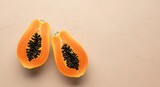 Halved papaya fruit showing black seeds and vibrant orange flesh