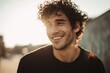 © AI Images - Smiling young man with curly hair wearing casual clothing outdoors sunny daytime.