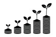 © MDMINTU - Growing plants sprouting from stacks of coins symbolizing financial growth and investment success
