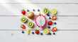 © Jacket - Colorful Fresh Fruits Arranged on a White Wooden Surface