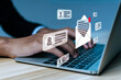 © Vittaya_25 - Notification. business man hand using laptop computer send mail message from mail box, new chat message, cyber security, digital marketing, business finance, internet network technology concept