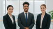 © dedy - Multiethnic business team smiling confidently in bright modern office space