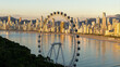 © Marcio Eneas - Golden hour view of Balneario Camboriu skyline with the FG Big Wheel ferris wheel at Barra Norte, Santa Catarina, Brazil.