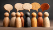© Bodrea - Diverse group of wooden figures with speech bubbles symbolizing communication