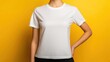 © afridwi - Woman in white t shirt on yellow background