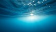 © hubaib - Underwater view showcasing sunlight filtering through the ocean surface, creating a luminous effect.