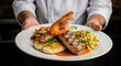 © DellTrow - Delicious grilled salmon steak with lemon on a plate