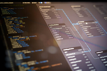 blurred close-up of sql database structure with source code and er diagram on screen, showcasing bac