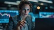 © Restyler - A female stock market trader is working on a laptop surrounded by glowing screens with financial charts. She is focused on analyzing data.