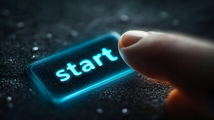 A finger about to press the glowing start button to begin the new journey 