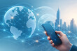 © Renuka - Digital technology smartphone with glowing world map and futuristic wireless global network communication concept