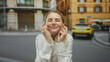 © Krakenimages.com - Woman crossing fingers on a city street outdoors showing hope luck expectation success blonde white shirt urban confidence excitement optimism happiness background