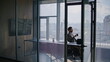 © stockbusters - Office man resting cityscape meeting room. Elegant director holding coffee cup