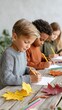 © ISVO - Young children engaged in creative drawing activity at a wooden table, surrounded by colorful autumn leaves, showcasing artistic expression and seasonal inspiration