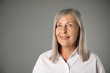 © New Africa - Portrait of beautiful senior woman on grey background. Space for text