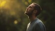 © CStock - A man stands in peaceful contemplation surrounded by nature, enjoying a moment of tranquility and self-reflection.