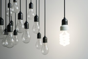 Wall Mural - hanging light bulbs with one glowing spiral cfl bulb among unlit traditional bulbs on neutral backgr