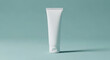 © Maidul - A single white tube of cream standing upright on a light blue background in a studio setting