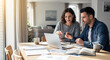 © Jamal Benamer - a couple doing taxes at home, working on a laptop, financial planning