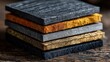 © junaid - Stack of textured composite material samples showcasing different colors and finishes for construction and design applications