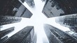 © Jojo* - A low-angle view of towering skyscrapers reaching towards a hazy, bright sky.