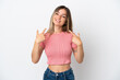 © luismolinero - Young Romanian woman isolated on white background giving a thumbs up gesture