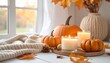 © photostockatinat - A cozy autumn scene with pumpkins, candles, and fall foliage, creating a warm, inviting atmosphere. Pumpkins, candles, autumn leaves and other elements.
