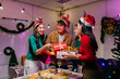 © Parichat - Friends exchanging gifts during Christmas dinner party