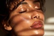 © Michael - Close-up of a woman's face with glowing skin, enjoying the sunlight, promoting skincare and wellness