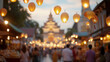 Lantern festival Yi Peng  with blurred temple and crowd at twilight, background