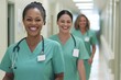 © Dusan - Multicultural Nurses Walking in Hospital
