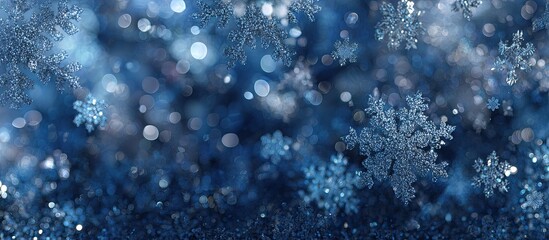 Falling snowflakes in a deep blue winter scene, with bokeh effect