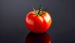© Bagas - Fresh tomato on dark surface