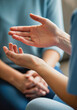 © Aurora Aesthetics - Psychiatrist nurse's hands gesturing calmly while talking to a patient during a therapy session