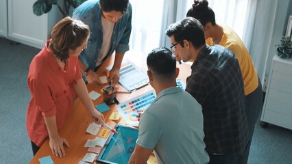 Time lapse of manager writing idea on sticky note and explain idea about web design. Professional marketing team or programmer brainstorming idea while looking at tablet with color palette. Symposium.