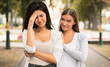 © Prostock-studio - Fake Friendship Concept. Gloating Girl Rejoicing At The Misfortune Of Crying Female Friend Standing Outdoors.