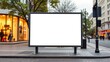 © Ai Gallerybd - Blank white billboard on a city street with shops and traffic lights