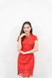 © ArLawKa - Beautiful Asian woman in cheongsam or Chinese dress on white background, Chinese New Year culture.