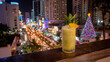 Refreshing Cocktail Drink Overlooking Pattaya Countdown Festival Nightlife with City Lights, Fireworks, and Christmas Holiday Celebration