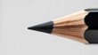 © Gambles - Sharpened to Perfection: Macro Detail of a Pencil's Graphite Tip and Wood Grain