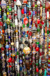 © Bolucevschi - Colorful strands of glass and stone beads, used for jewelry and decorations, found at a market stall.