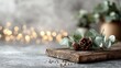 © Kompor - Rustic wooden board with pinecones and eucalyptus