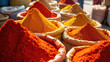© Lisa - Brightly colored piles of ground spices in fabric bags at an outdoor market, vibrant textures and shades of red, orange, and yellow under natural sunlight
