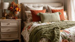 © noiteterna - Dormitorio con cabecero capitoné beige, ropa de cama floral y manta verde, decorado con flores otoñales y lámpara beige, ideal para interiores cálidos, estilo rústico y diseño estacional acogedor.