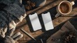© Jen - Two Smartphones Mockup on Wooden Desk with Winter Accessories