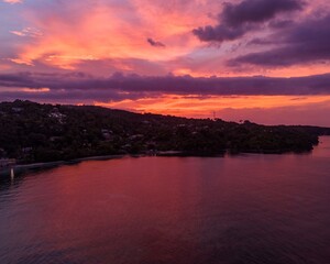 Wall Mural - Stunning sunset over serene coastline