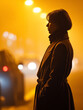 © Lxyzuu - A Contemplative Figure in a Coat Silhouetted Against an Amber-Hued, Foggy Urban Background Scene